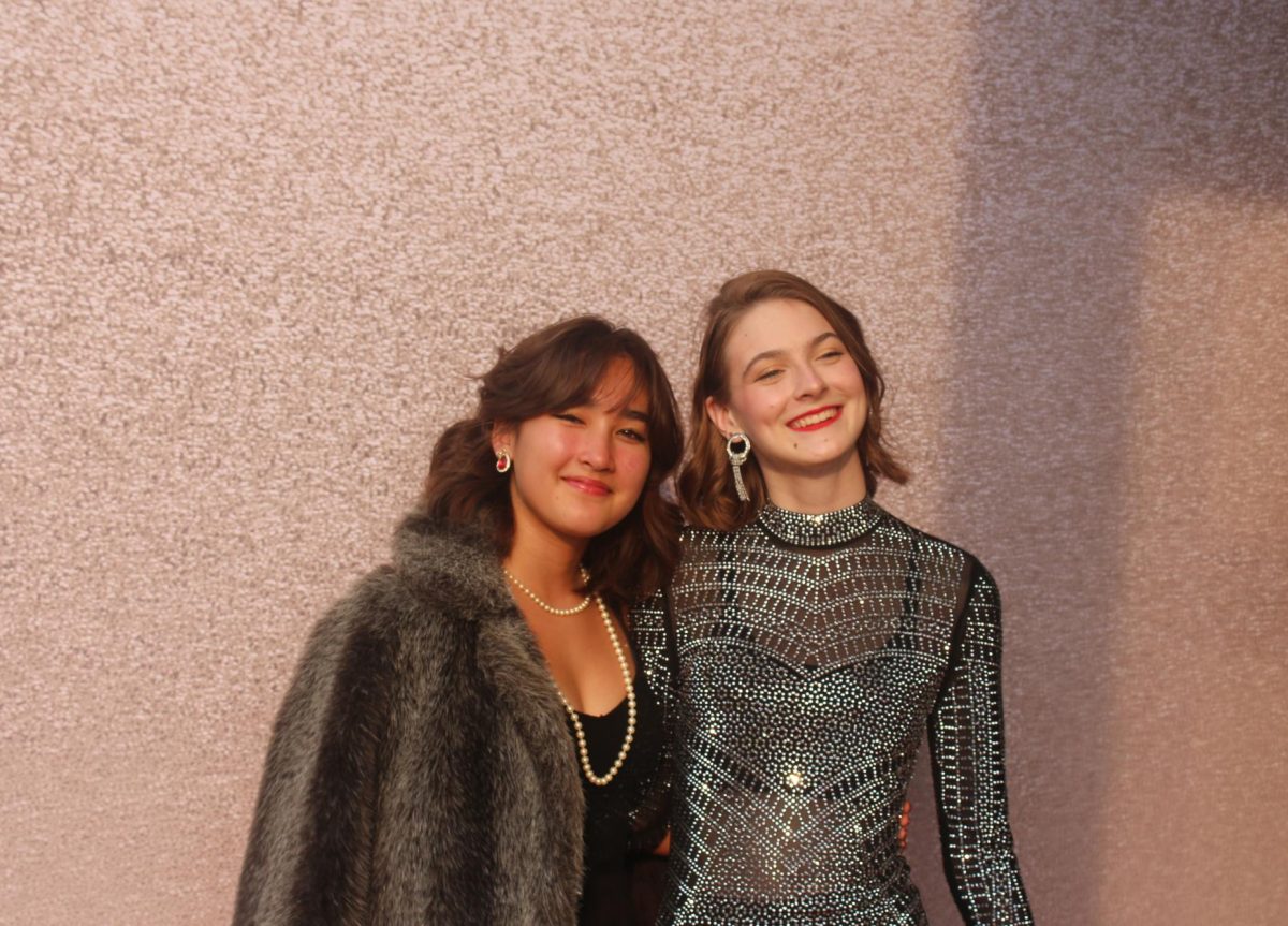 Sophomores Leela Bertram and Elise Turner pose on the red carpet for the Hollywood-inspired theatre banquet.