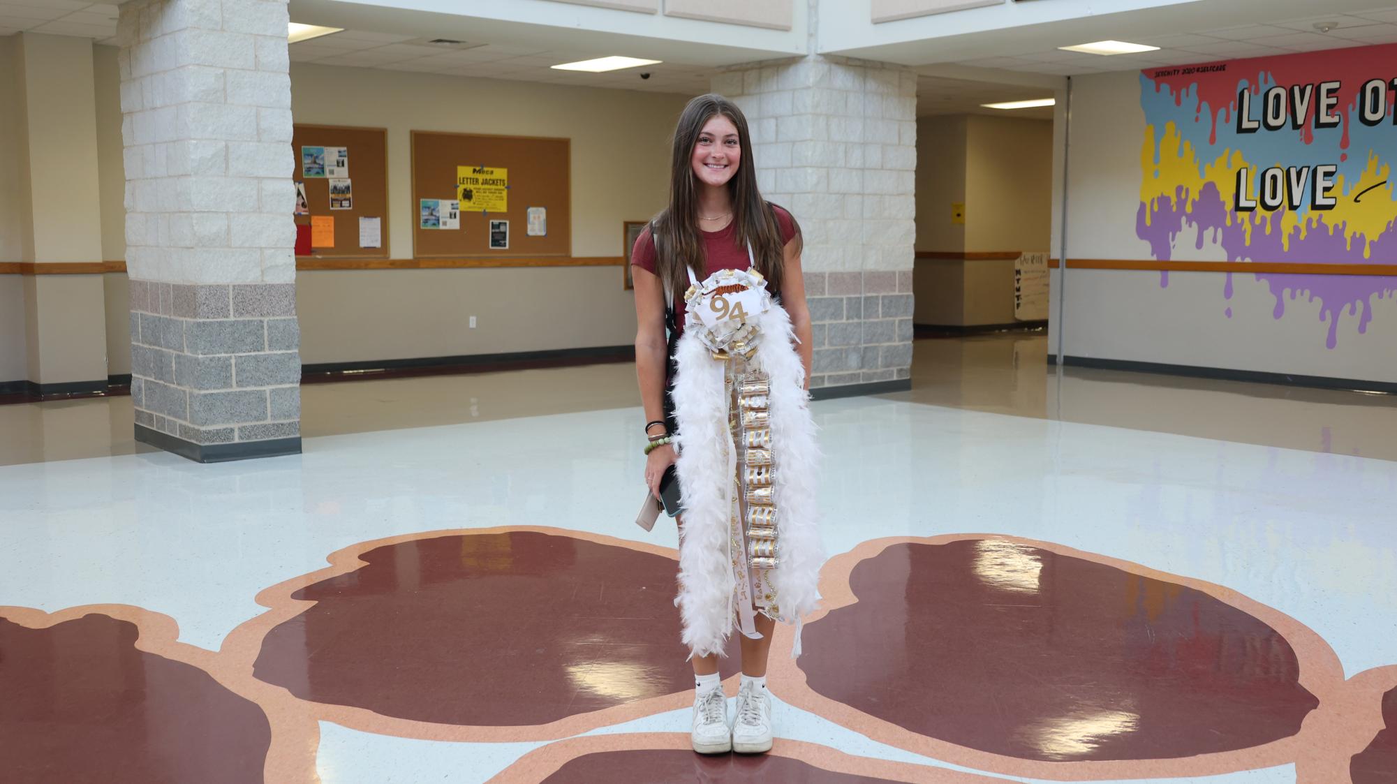 Senior Julia Stankov showing off her all-white mum from football player Clive Wahl.